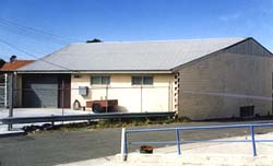 Colour picture: the AMRA NSW Rockdale clubrooms in 2000. The roof profile of the original building can be seen.